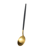 Cuillère métal doré et manche noir élegant